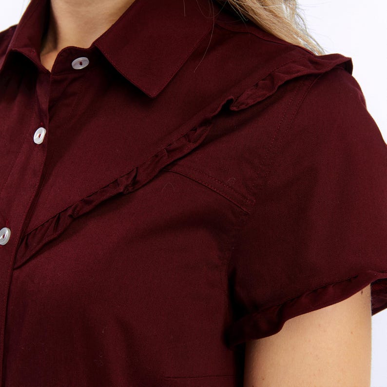 Blusa abotonada con volante de algodón