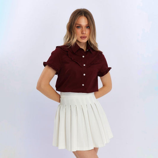 Blusa abotonada con volante de algodón